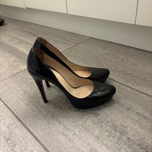 Prada black patent leather pumps